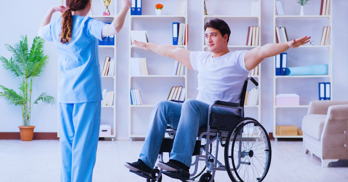 A chiropractor in a gray shirt performing a specialized manual hip and pelvic mobilization on a patient to provide post-surgical rehabilitation at Spine and Joint Center in Fort Lauderdale.