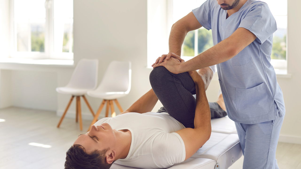 Activator Method chiropractor performing a low-force adjustment in Fort Lauderdale