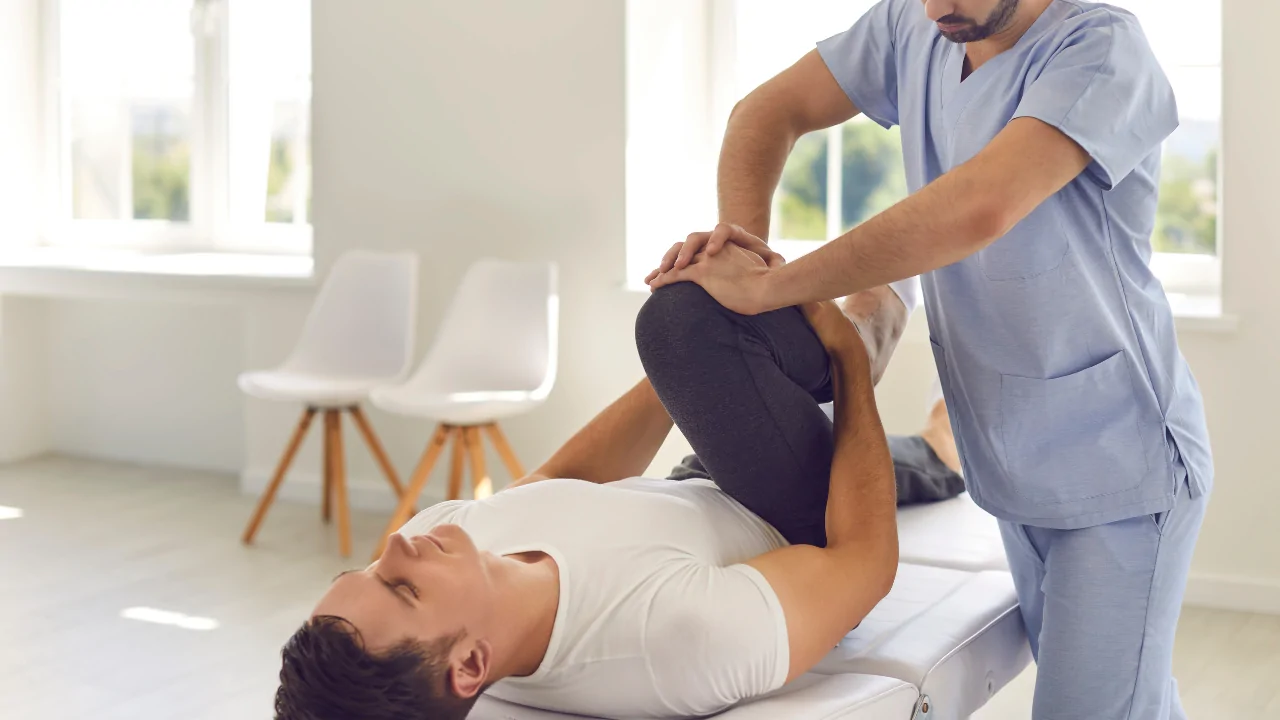 Activator Method chiropractor performing a low-force adjustment in Fort Lauderdale