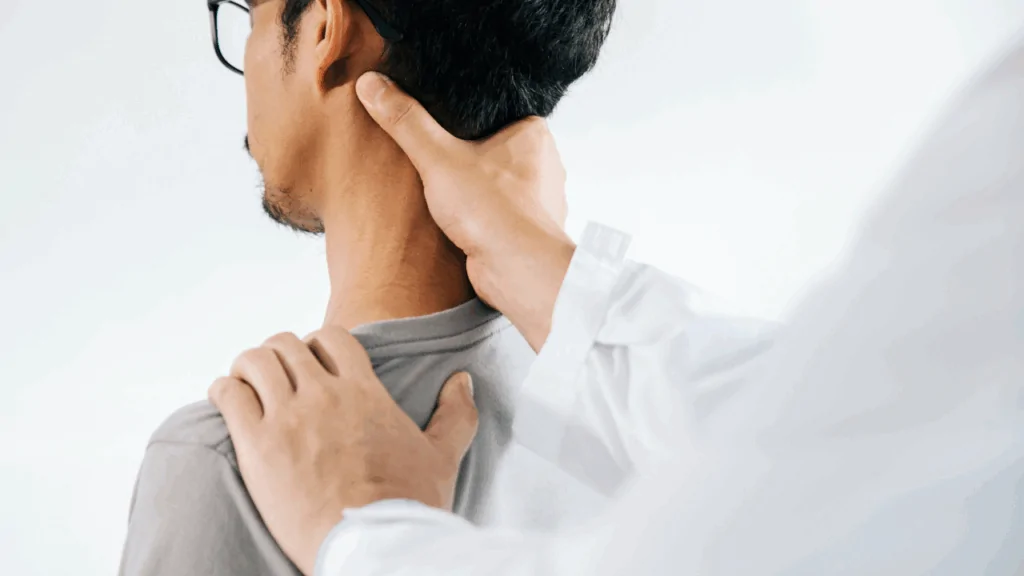 A chiropractor applying targeted pressure to a patient's neck to provide effective text neck treatment in Fort Lauderdale.