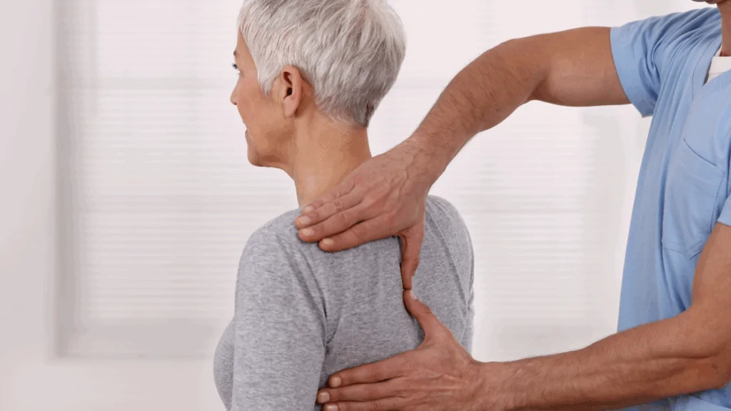 A chiropractor performing a gentle spinal adjustment on a patient to support holistic chiropractic therapy at Spine and Joint Center in Fort Lauderdale.
